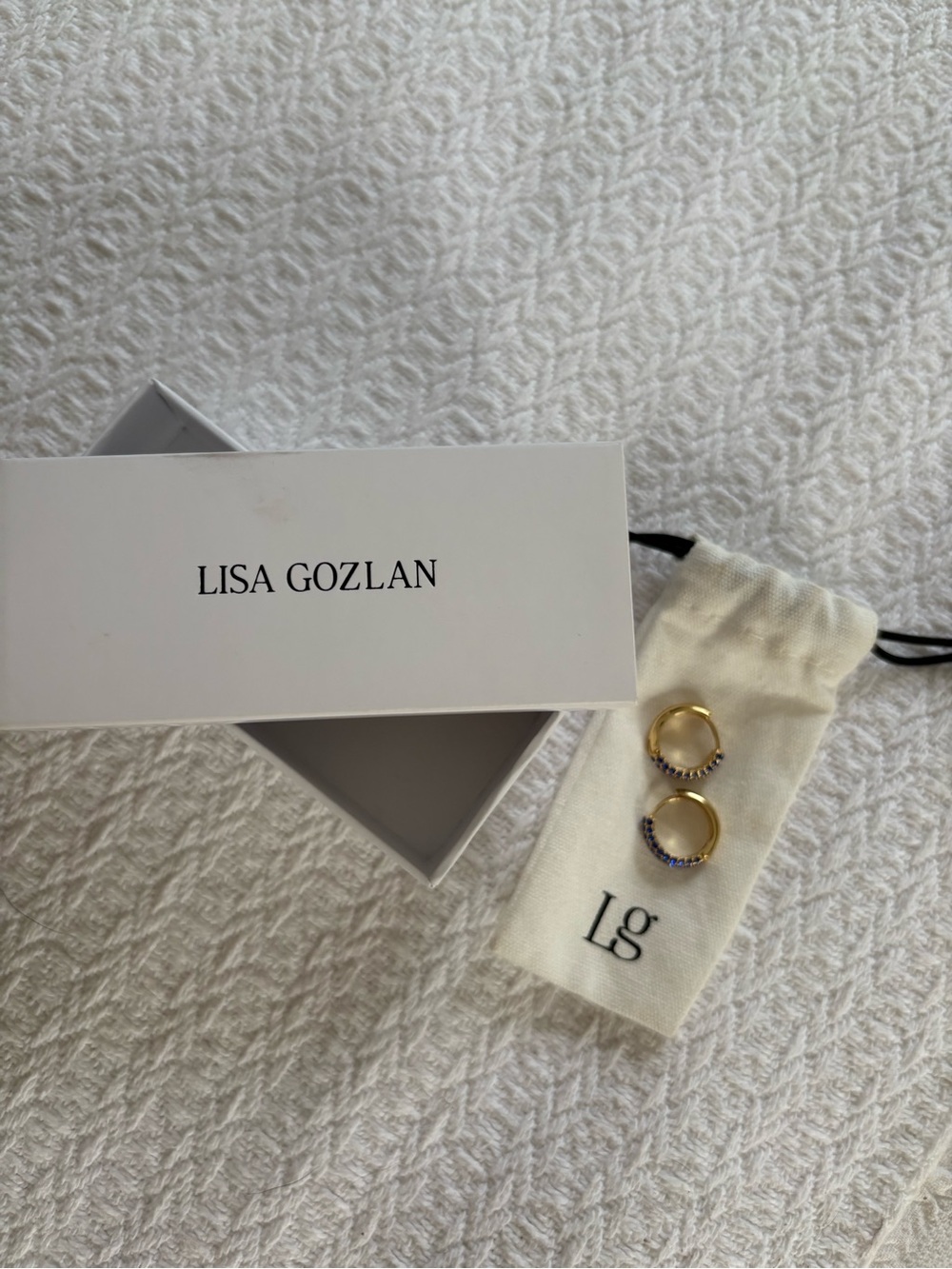 Lisa Gozlan Gold Huggie Hoop Earrings with Blue Stones